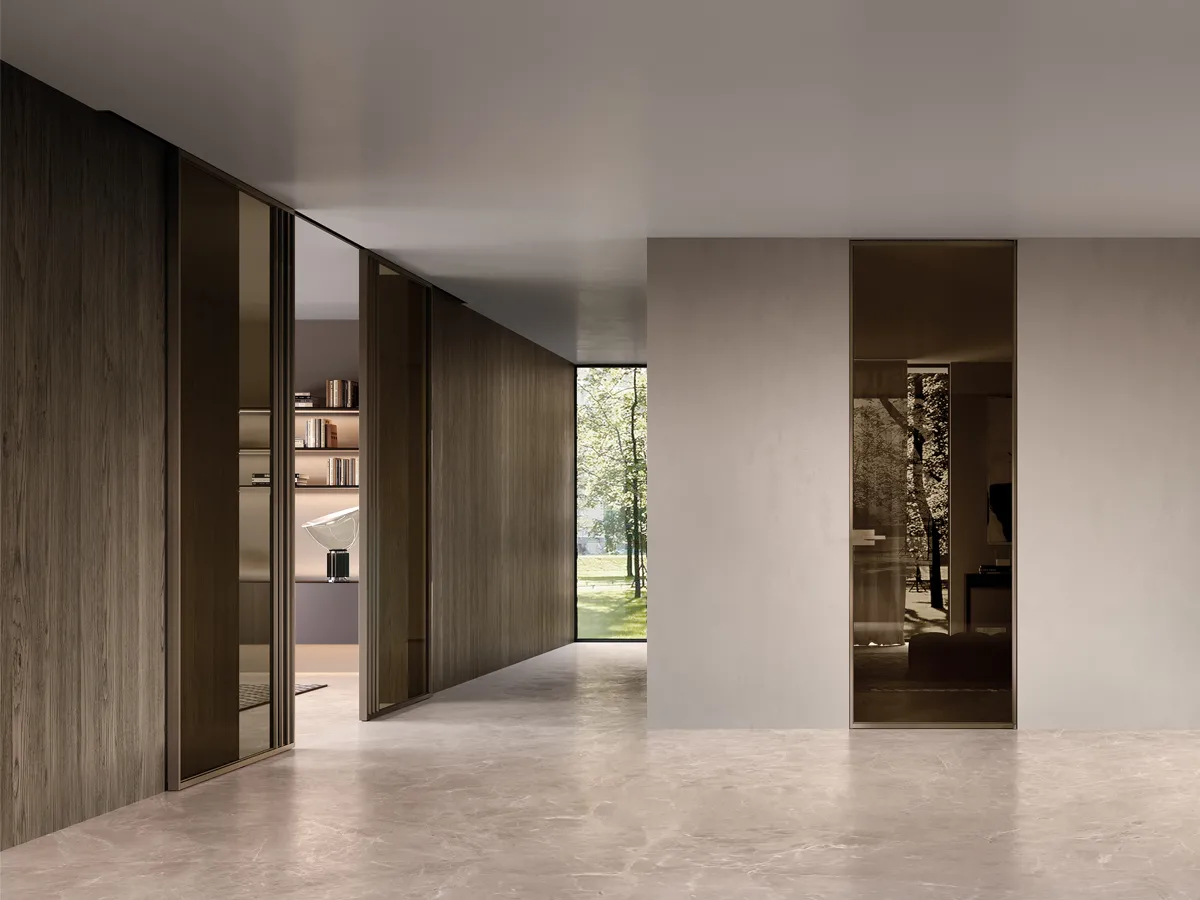 Sliding doors integrated into wall paneling