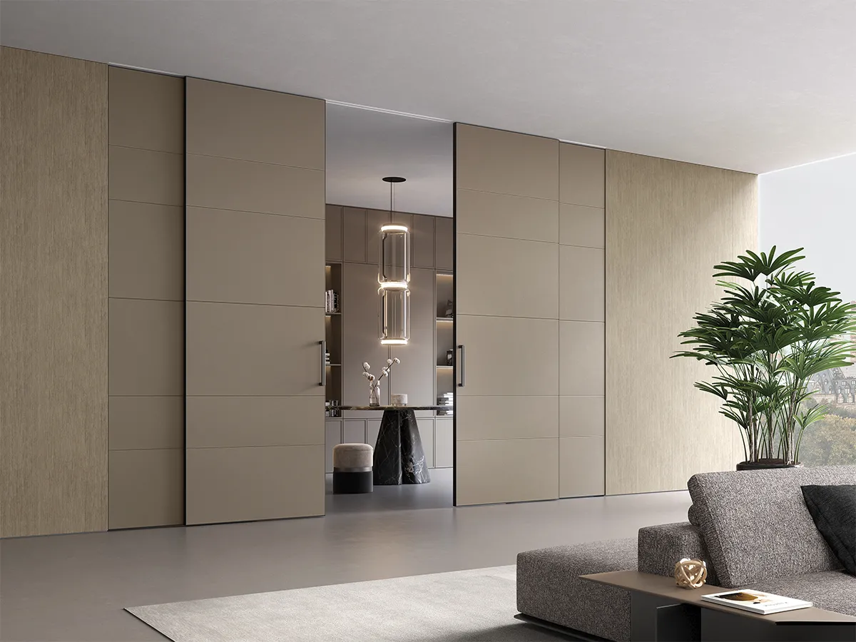 Sliding doors integrated into wall paneling