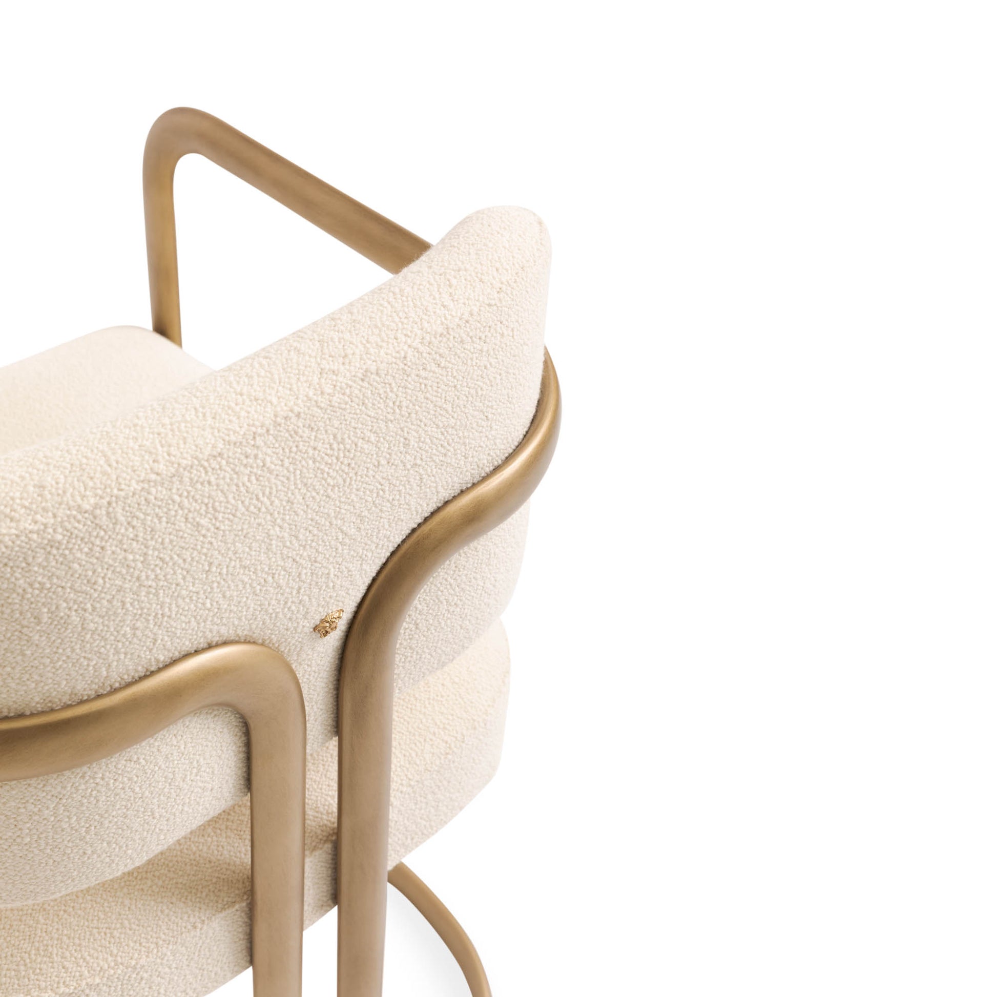 Oval-section curved tubular metal — bronze finish detail