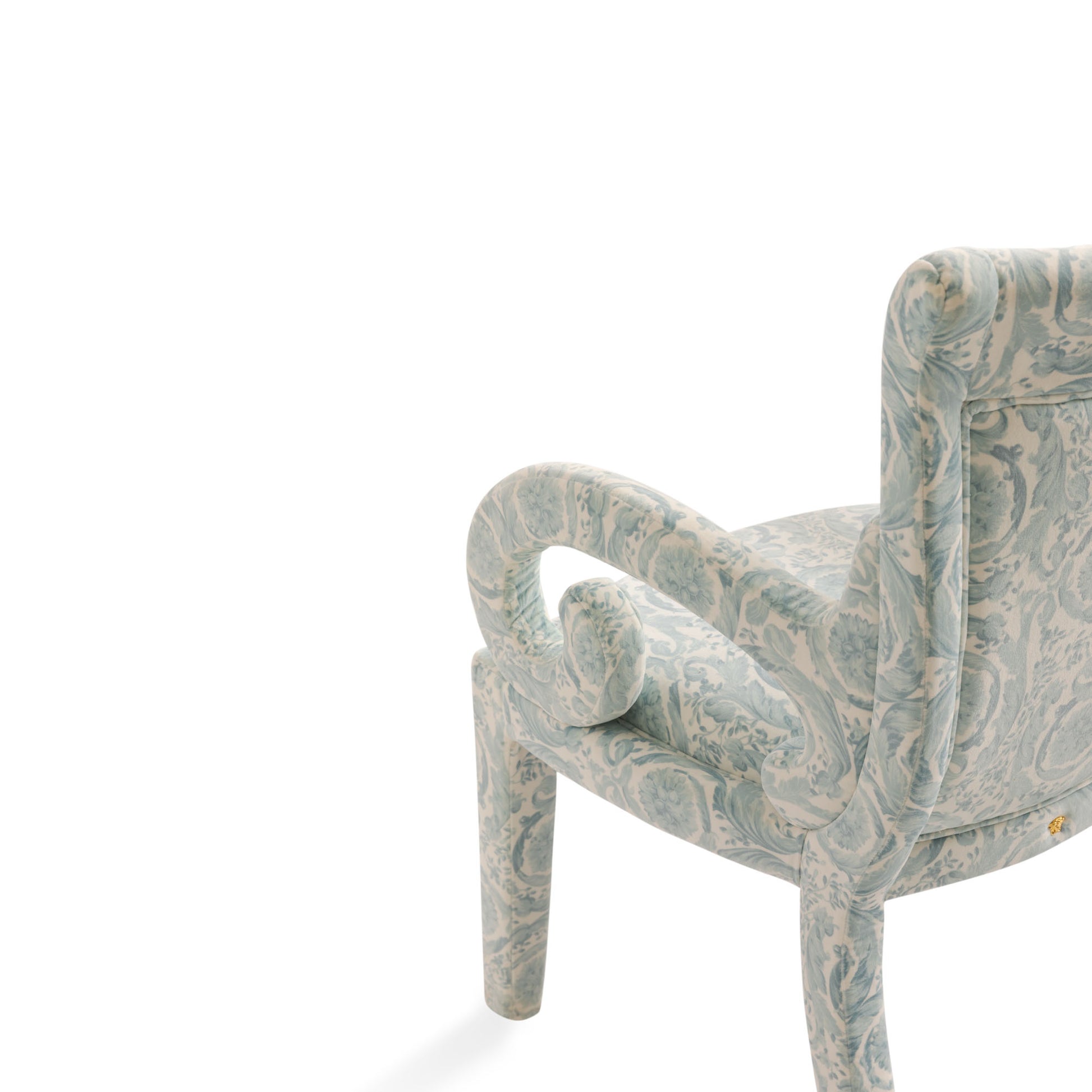 Sculpted armrest detail — green velvet